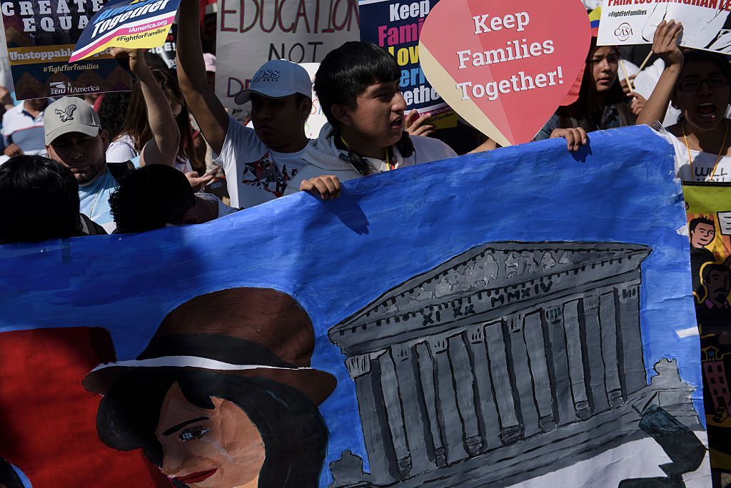 Supporters of immigration reform rally outside the Supreme Court.