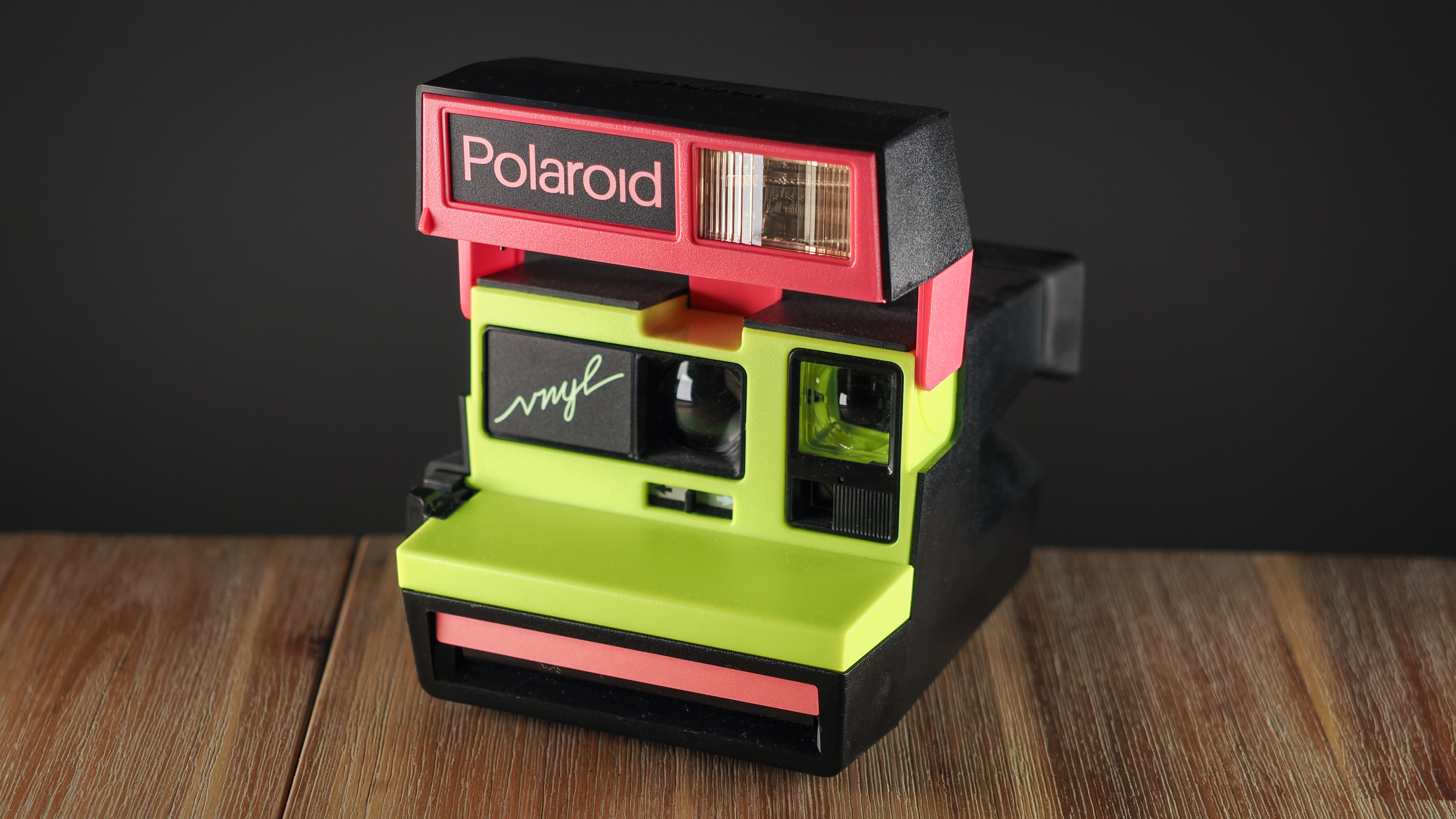 Polaroid Vnyl on a wooden surface