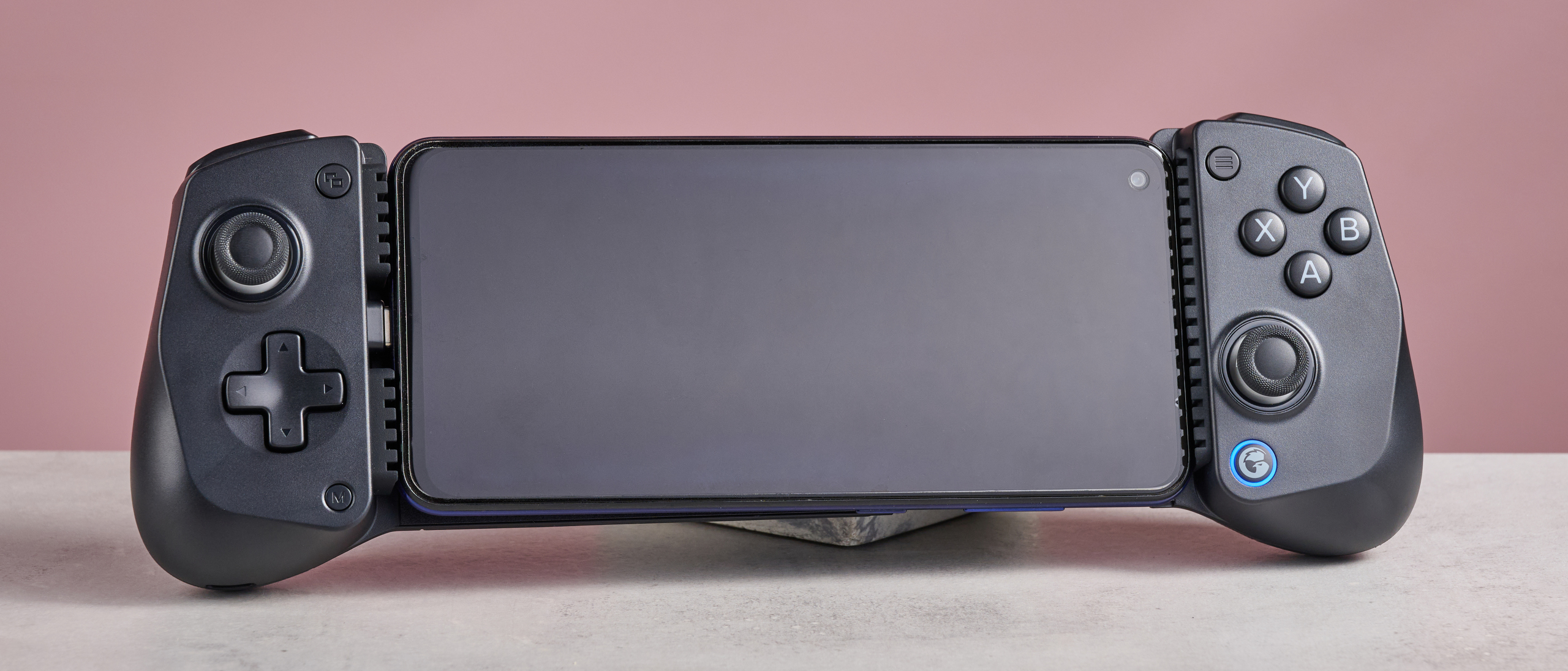 GameSir X5 Lite on white desk with pink wall in background