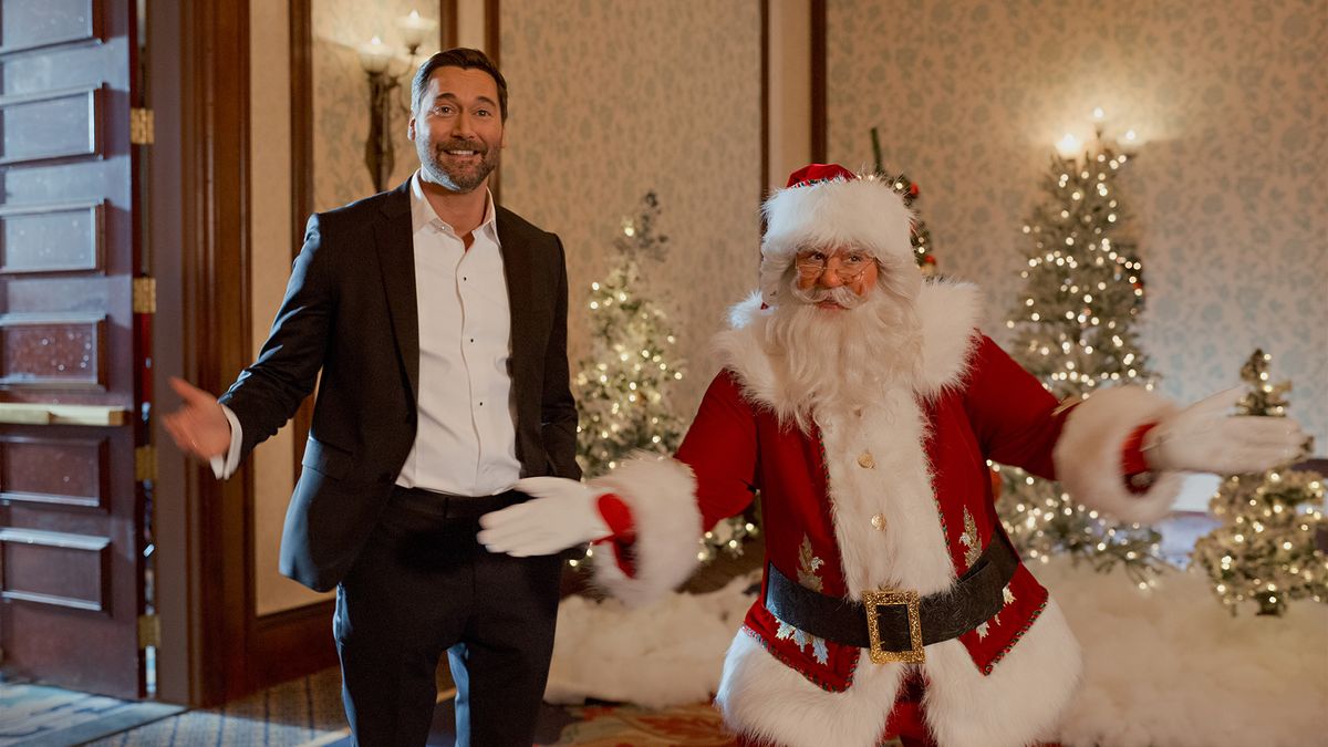 Ryan Eggold as Matthew and Alexandra Breckenridge as Santa Claus in My Secret Santa.