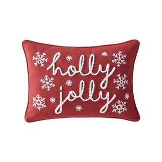 red Christmas pillow that says holly jolly