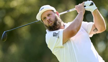 Beef hits his tee shot with a driver