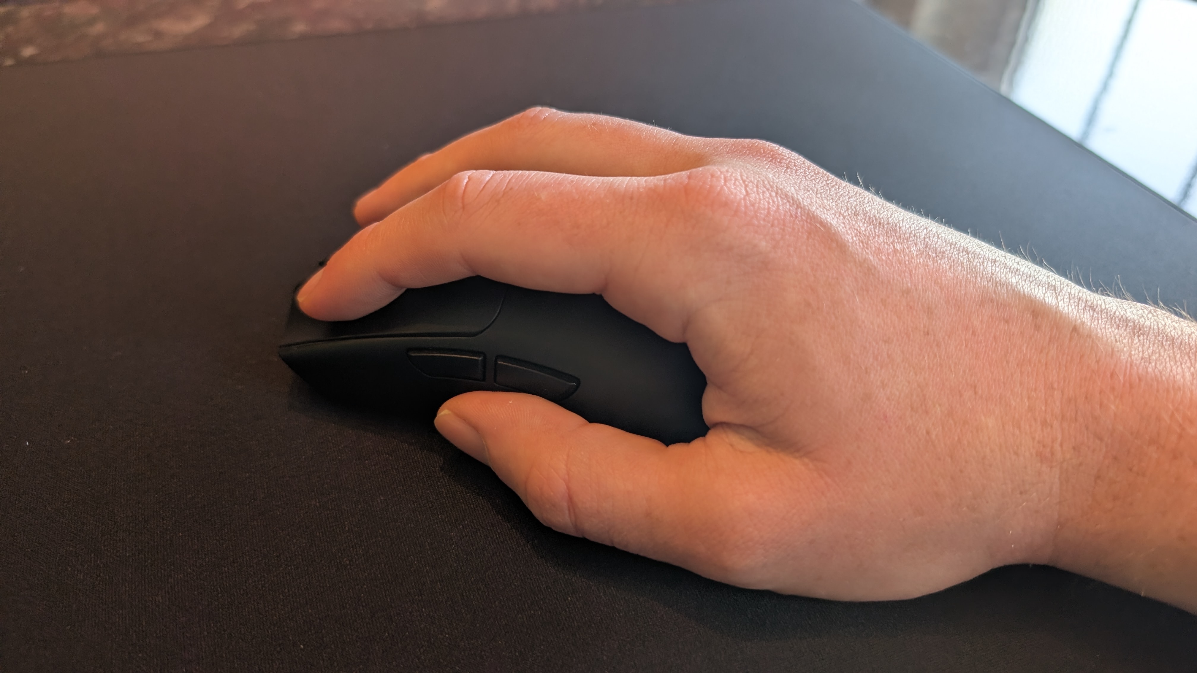The Razer Viper V4 Pro gaming mouse pictured on the Razer Gigantus V2 Pro mouse mat.