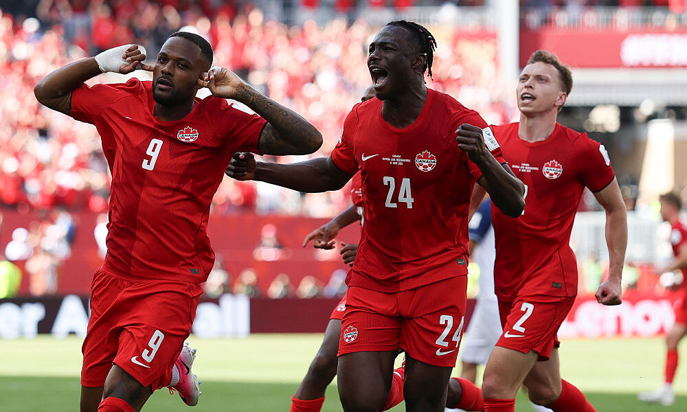 Cyle Larin of Canada celebrates scoring his team's first goal during the FIFA World Cup 2026 Group B match between Canada and Bosnia and Herzegovina at Toronto Stadium. 