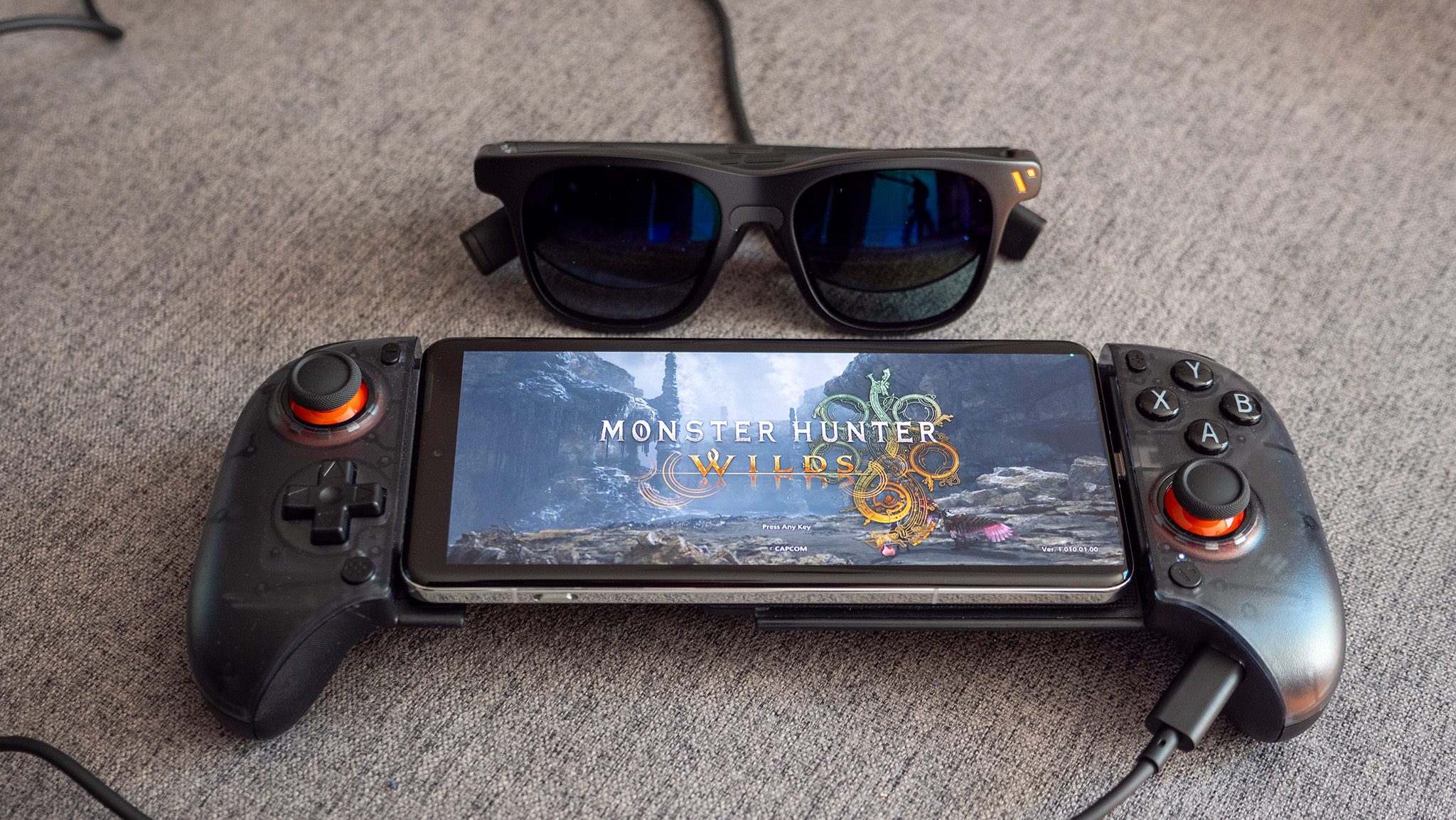 Playing Monster Hunter Wilds via GeForce Now on a OnePlus 13, docked into a Viture x 8BitDo Ultimate Mobile Controller with a pair of Viture Pro smart glasses plugged in