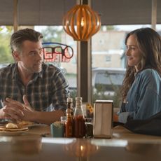 josh duhamel and minka kelly talk at a diner bar during breakfast in a still from ransom canyon season 2 