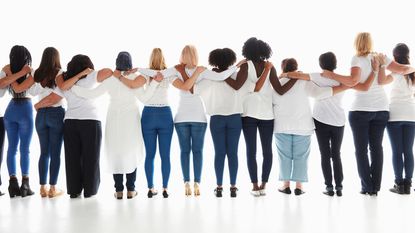 Row of diverse women hugging