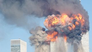 394261 12: A fiery blasts rocks the World Trade Center after being hit by two planes September 11, 2001 in New York City. (Photo by Spencer Platt/Getty Images)