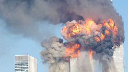 394261 12: A fiery blasts rocks the World Trade Center after being hit by two planes September 11, 2001 in New York City. (Photo by Spencer Platt/Getty Images)