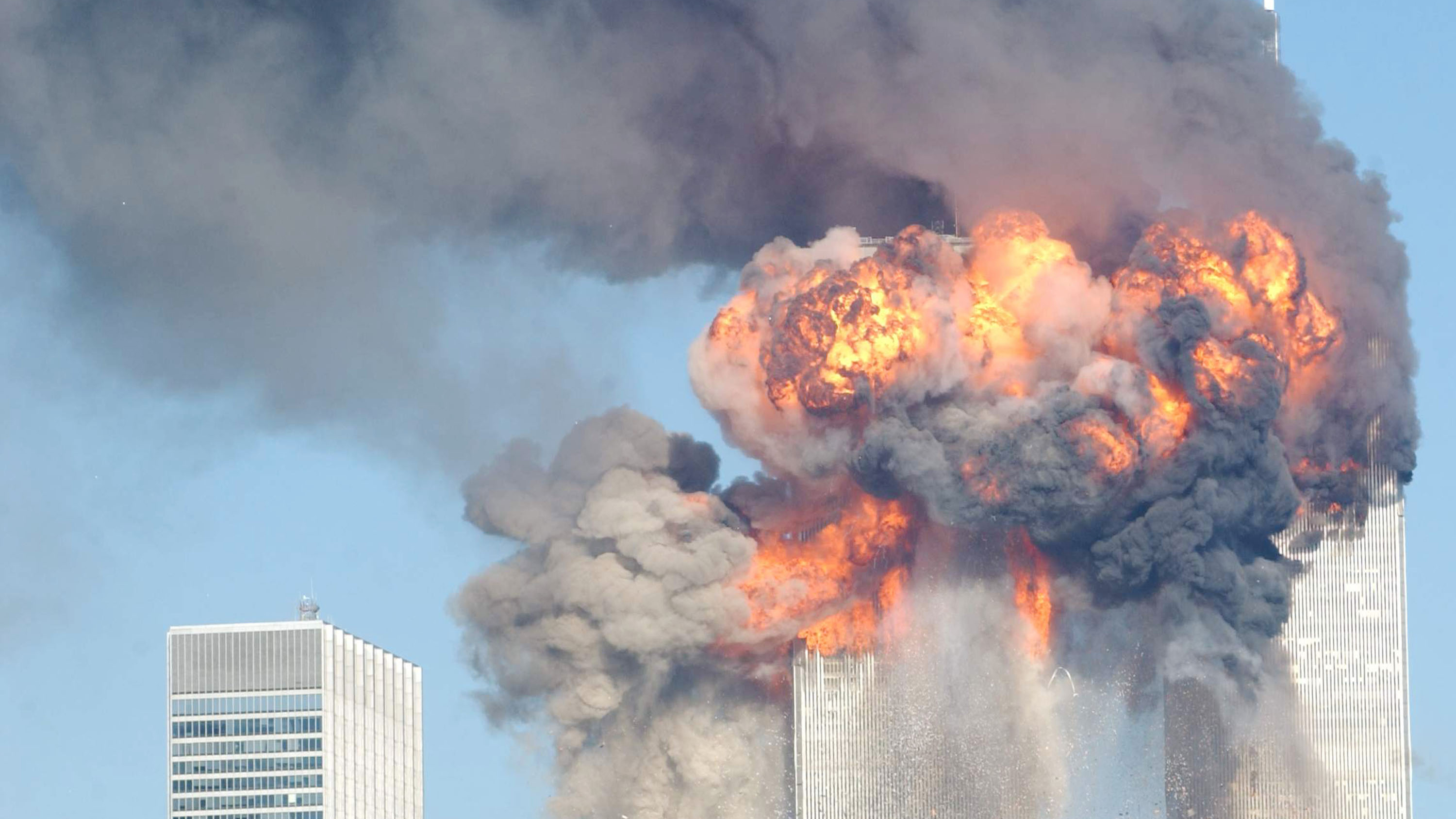 394261 12: A fiery blasts rocks the World Trade Center after being hit by two planes September 11, 2001 in New York City. (Photo by Spencer Platt/Getty Images)
