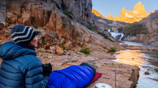 A woman camps out at Fitz Roy cascades near Mount Fitz Roy