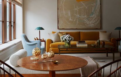 a living room with a blue and yellow color scheme