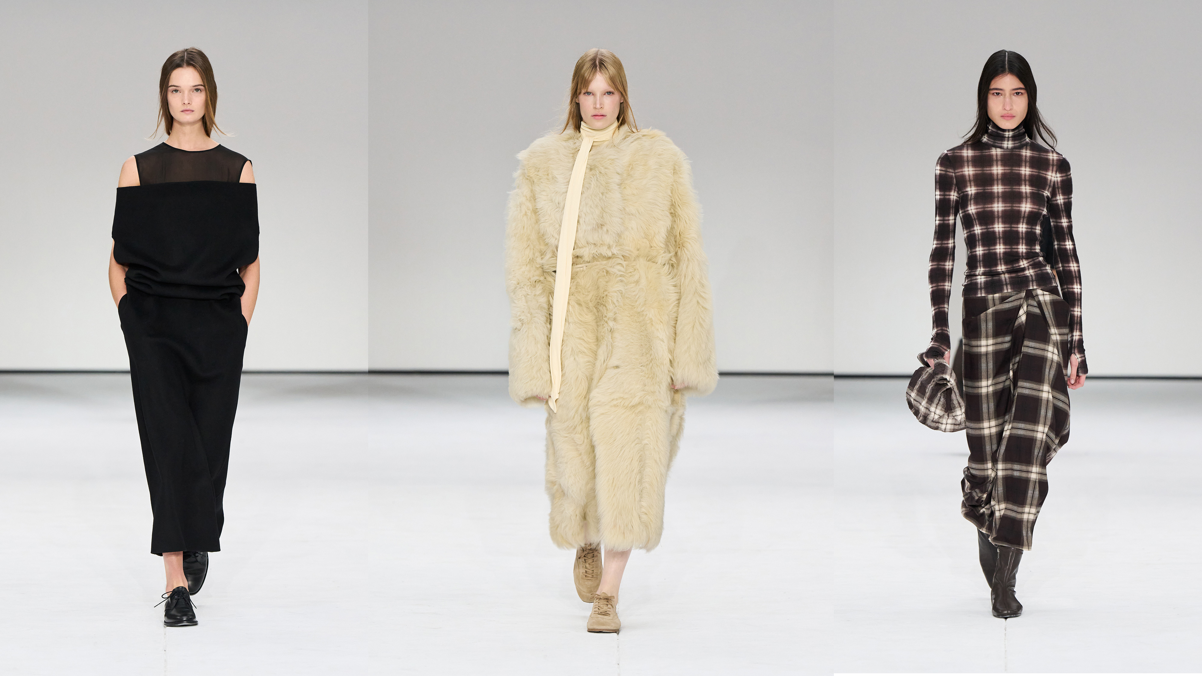 Three models walk the COS runway show.