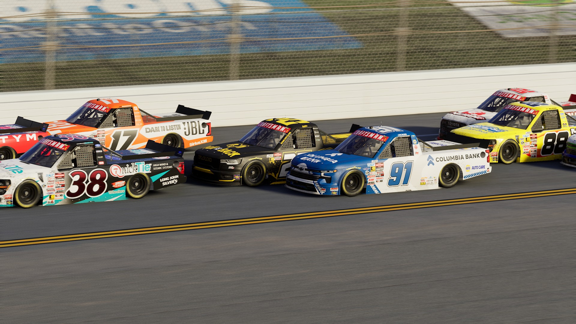 A screenshot from NASCAR 26 showing a Craftsman Truck Series race at Talladega featuring Tony Stewart.