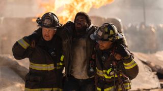 Mouch and Ritter helping a victim in the Chicago Fire episode of One Chicago's 2025 crossover