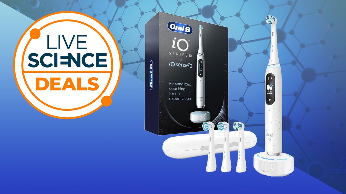 An Oral-B iO Series 10 electric toothbrush, with several spare heads and its box next to it, 