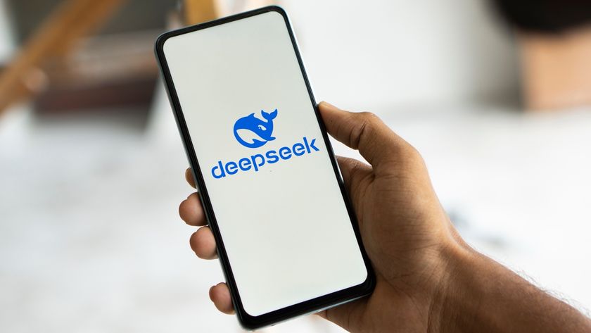 The DeepSeek AI logo is seen on a smartphone held in the hand