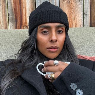 Monikh Dale wearing rings and a white blouse