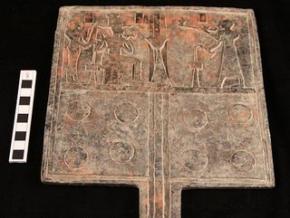 A tin-bronze offering table was found in one of the tombs beneath a pyramid in the cemetery in Sudan.