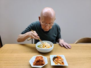 Portrait of artist Park Seo-Bo with his janchi guksu