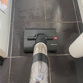 Using the Dyson WashG1 on black tiled bathroom floor