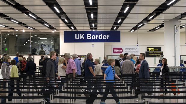 LONDON, ENGLAND - MAY 28:Border Force check the passports of passengers arriving at Gatwick Airport on May 28, 2014 in London, England. Border Force is the law enforcement command within the 