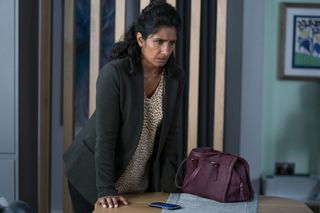 Suki Panesar is fearful after a call in EastEnders