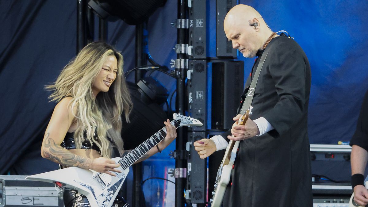 From left, Kiki Wong, Billy Corgan and Jack Bates of The Smashing Pumpkins perform at Fenway Park