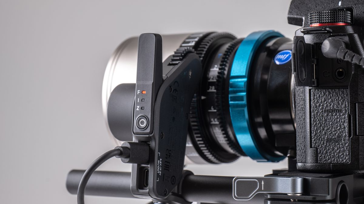 Closeup DJI RS 4 gimbal Focus Pro system on a off-white background