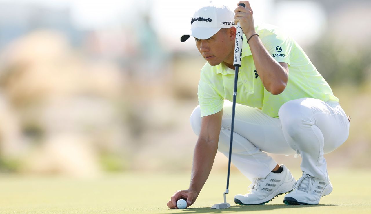 Collin Morikawa lines up a putt 