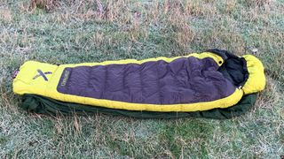 OEX Leviathan EV 900 sleeping bag on grass outdoors