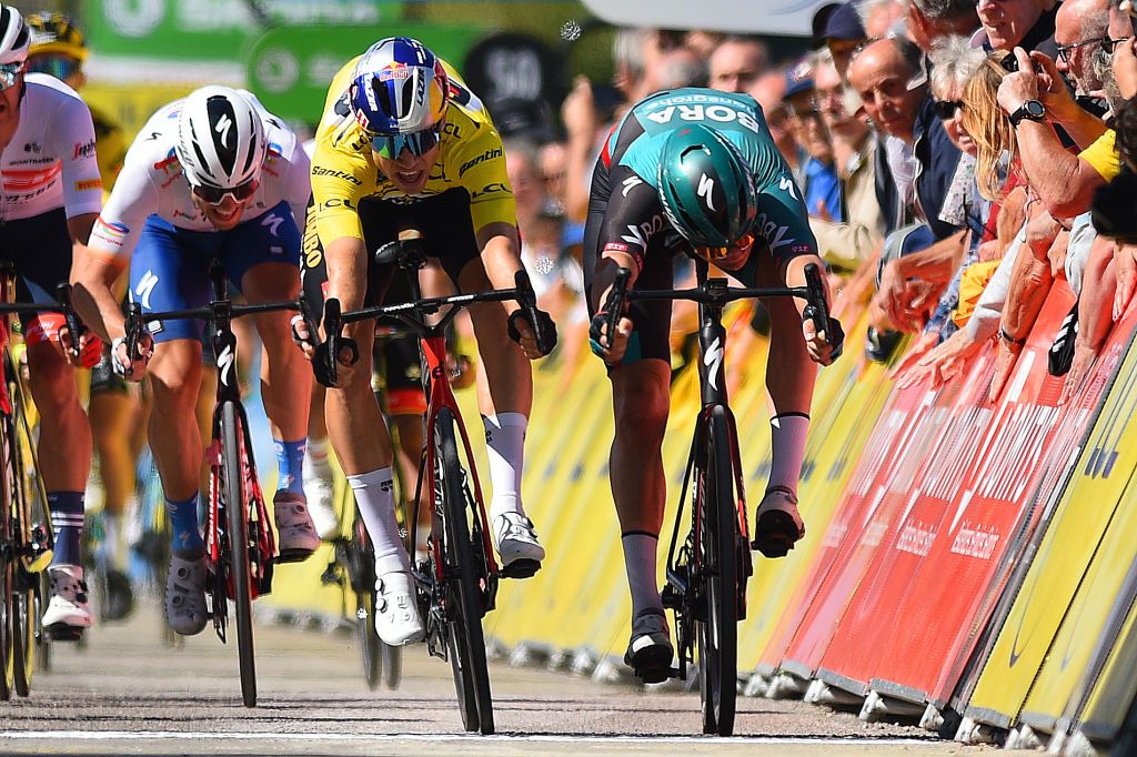 CHAINTRE FRANCE JUNE 09 LR Ethan Hayter of United Kingdom and Team INEOS Grenadiers White Best Young Rider Jersey Wout Van Aert of Belgium and Team Jumbo Visma Yellow Leader Jersey and Jordi Meeus of Belgium and Team Bora Hansgrohe sprint to win during the 74th Criterium du Dauphine 2022 Stage 5 a 1623km stage from ThizylesBourgs to Chaintr WorldTour Dauphin on June 09 2022 in Chaintre France Photo by Dario BelingheriGetty Images