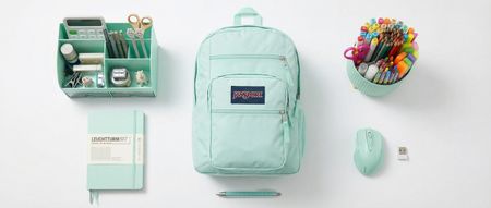 A selection of mint green home office gear on a white desk