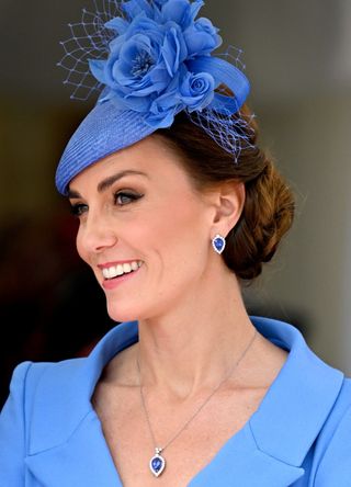 Kate Middleton wearing a blue outfit with matching jewellery