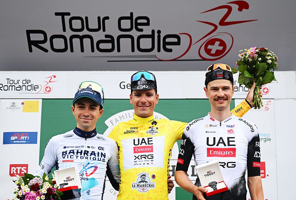 GENEVA SWITZERLAND MAY 04 LR Lenny Martinez of France and Team Bahrain Victorious on second place race winner Joao Goncalves Almeida of Portugal and UAE Team Emirates XRG Yellow Leader Jersey and Jay Vine of Australia and UAE Team Emirates XRG on third place pose on the podium ceremony after the 78th Tour De Romandie 2025 Stage 5 a 171km individual time trial stage from Geneve to Geneve UCIWT on May 04 2025 in Geneva Switzerland Photo by Dario BelingheriGetty Images