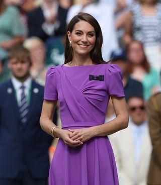 Kate Middleton wore a bow pin with the purple dress she wore to day fourteen of The Championships Wimbledon 2024