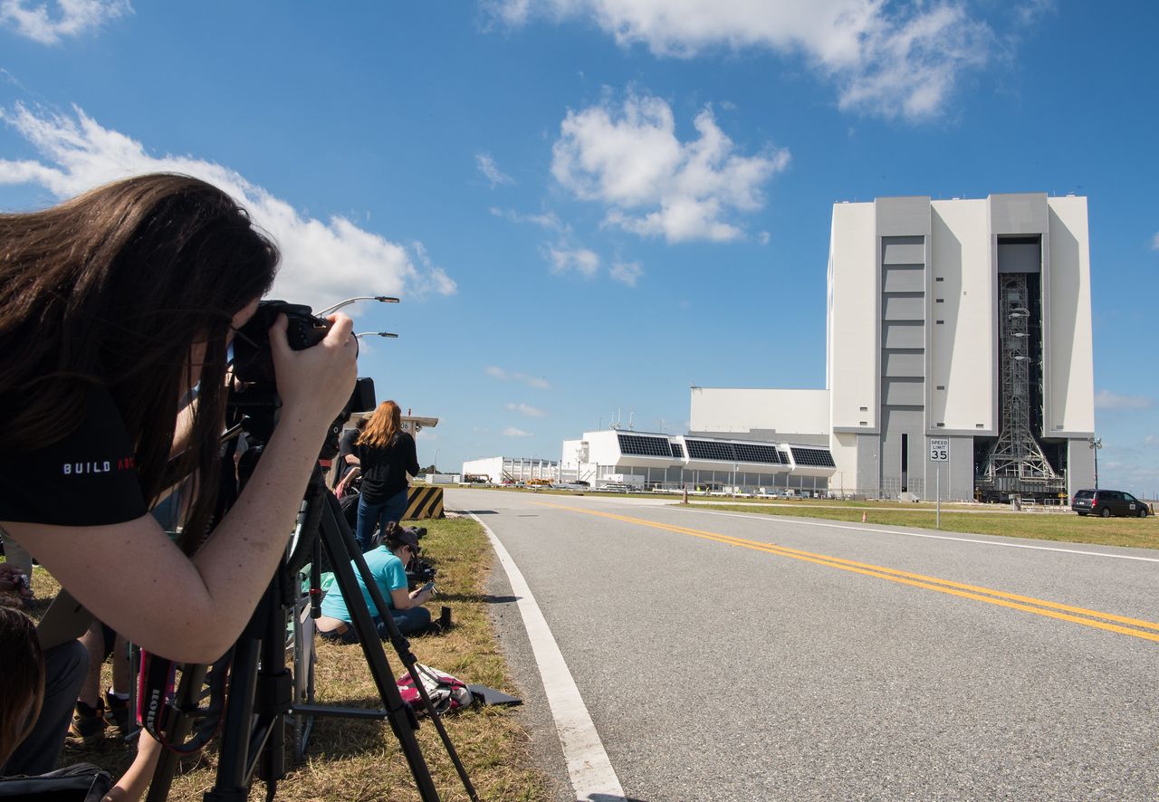 Media is seen documenting the opening of the doors to High Bay 3 of the Vehicle Assembly Building before the mobile launcher with NASA&rsquo;s Space Launch System (SLS) rocket and Orion spacecraft aboard are rolled out to Launch Complex 39B for the first time, Thursday, March 17, 2022, at NASA&rsquo;s Kennedy Space Center in Florida.