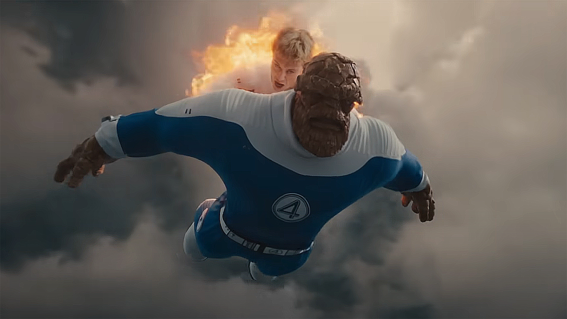 The Human Torch flying and carrying Ben Grimm in The Fantastic Four: First Steps