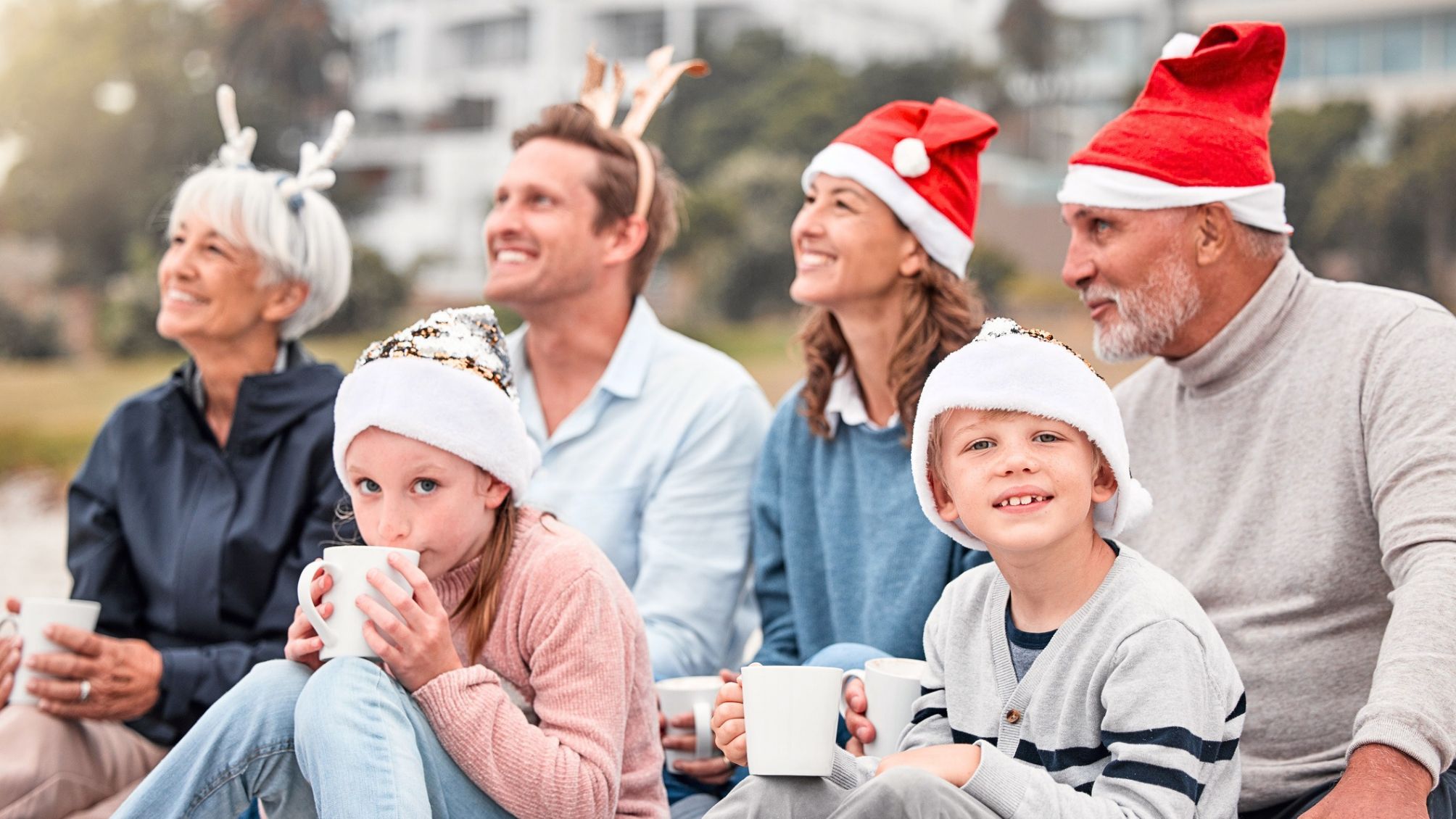 Parents, grandparents and kids with drink in family celebration