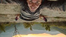 A man takes a crazy upside down selfie.