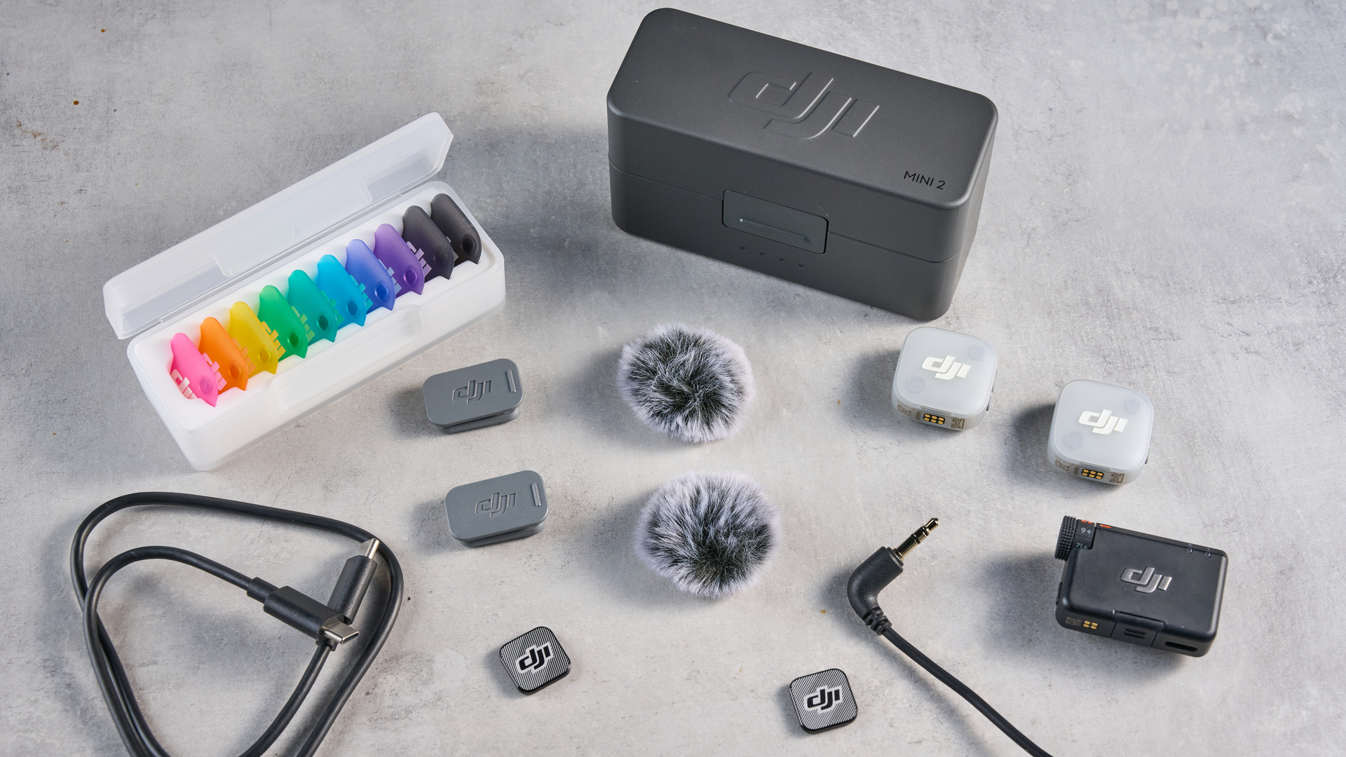 the dji mic mini 2 for camera and smartphone conent creators photographed against the blue tom's guide background