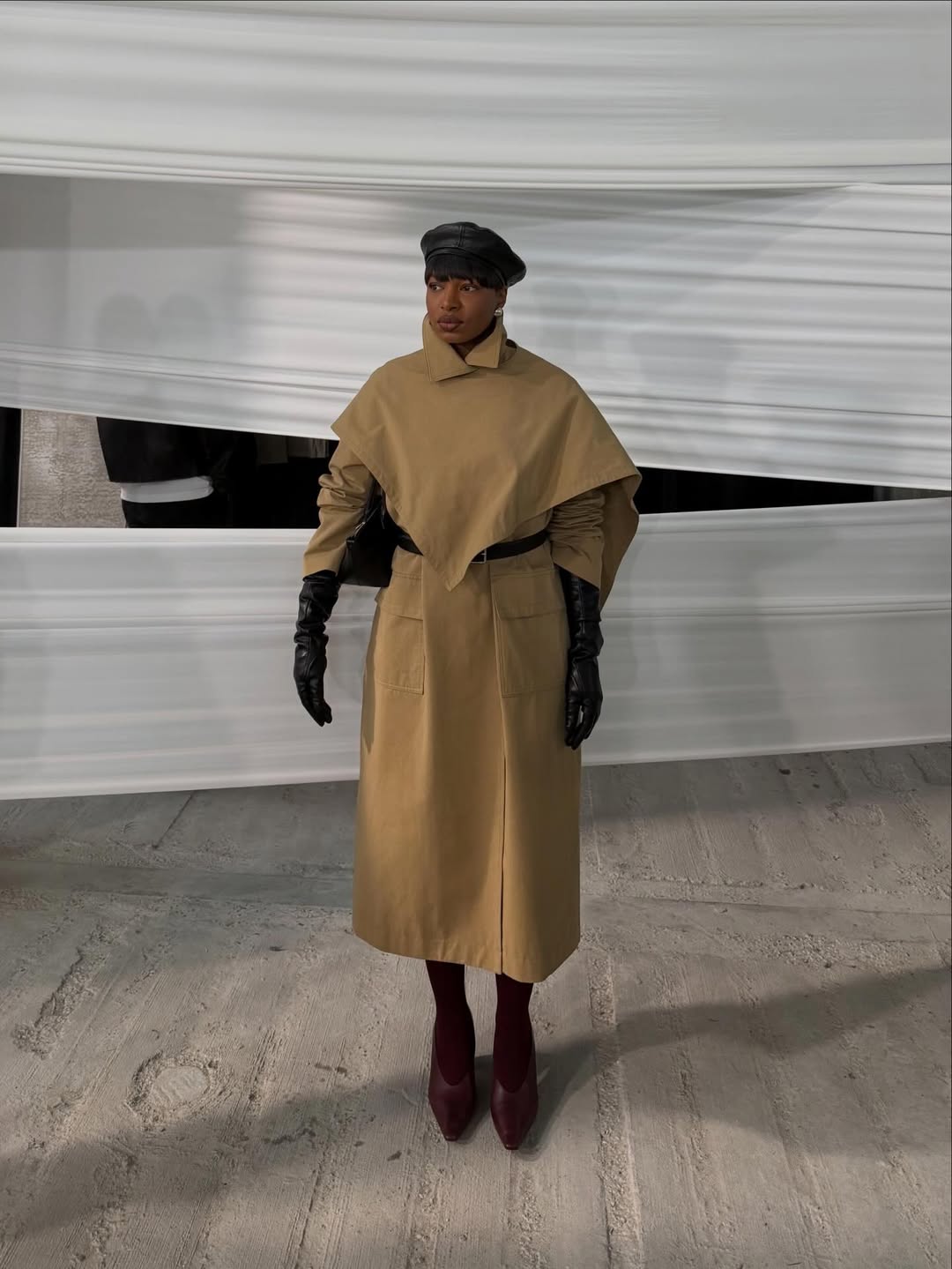 Lo&iuml;cka Gr&acirc;ce wears a cape trench coat