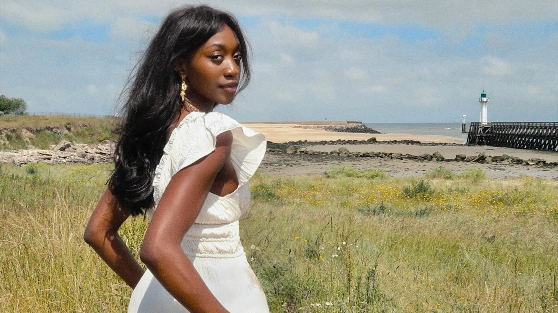 a woman outside in a field