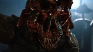 A close up of an Alien from A Quiet Place with a splintered face and sharp teeth