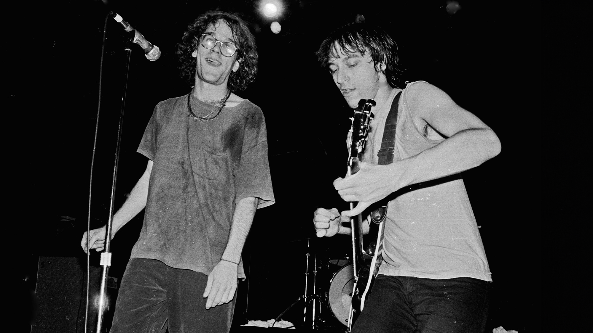 Michael Stipe and Peter Buck performing live onstage, June 22, 1984, at the Palladium