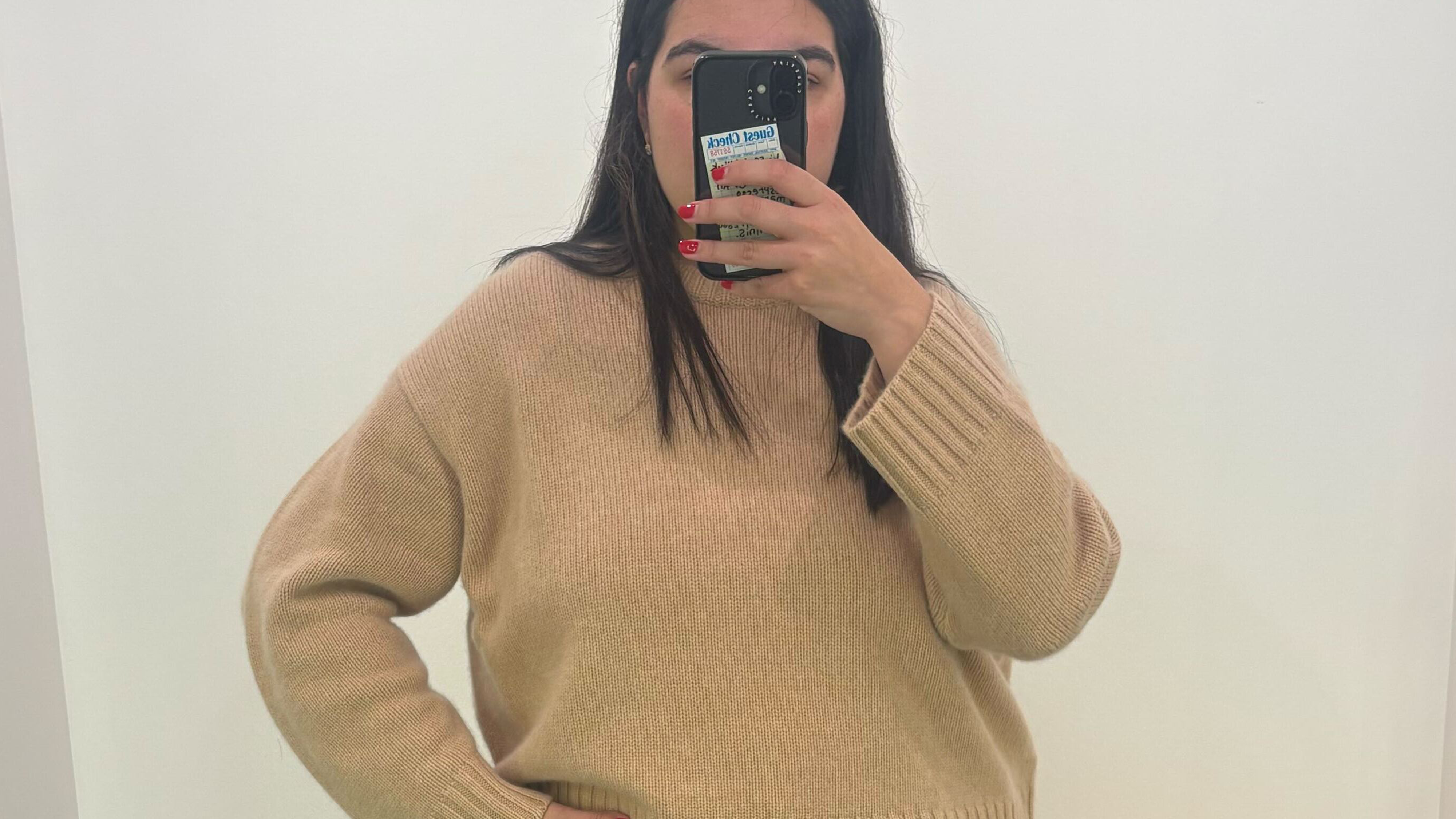 Who What Wear editor Ana Escalante tries on the the viral COS chunky cashmere sweater in beige.