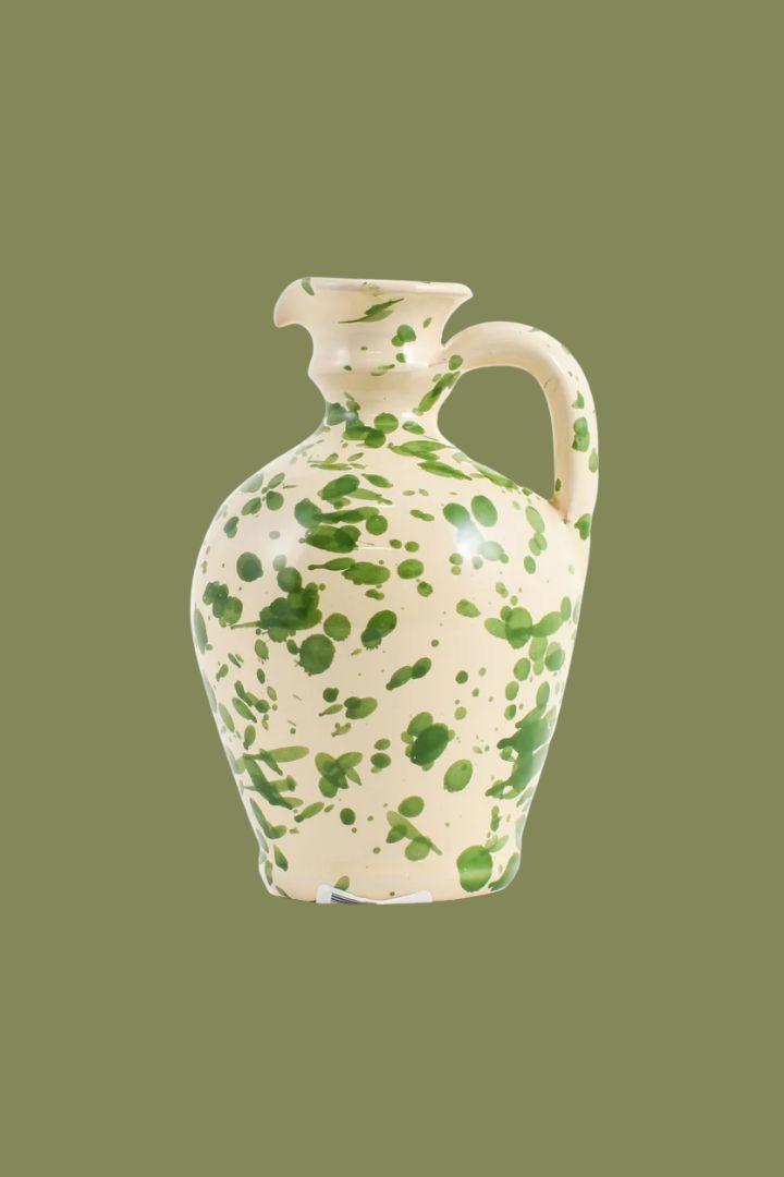 Sous Chef Puglia Green Splatter Oil Bottle, 250ml against dark green background.