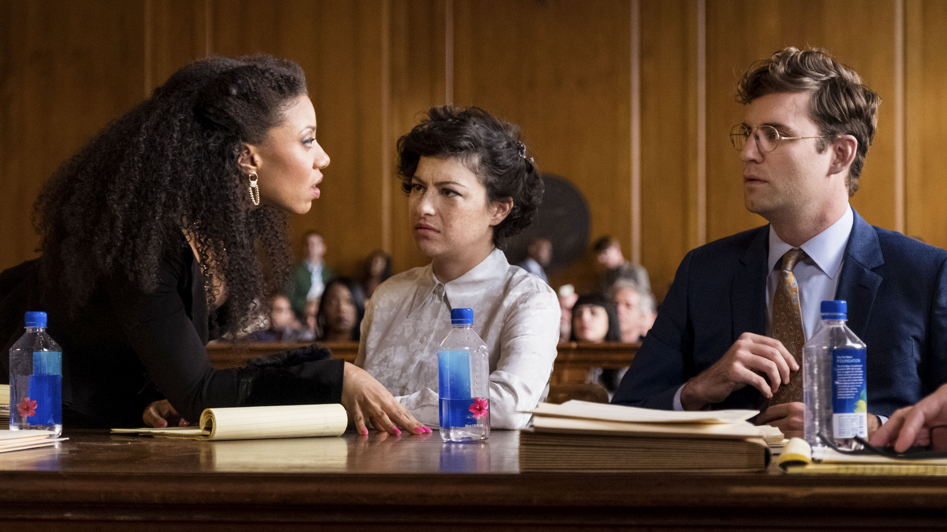 L-R: Shalita Grant, Alia Shawkat, John Reynolds in a courtroom scene from "Search Party" season 3