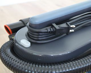 Cord wrapped around the Shark MessMaster carpet vacuum cleaner