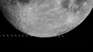 A close-up of the lower half of the moon, with a time-lapse showing tiny Saturns visible in a line behind the Moon